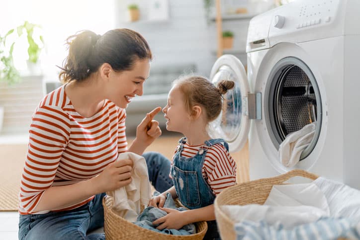 Mom with Daughter Doing Laundry