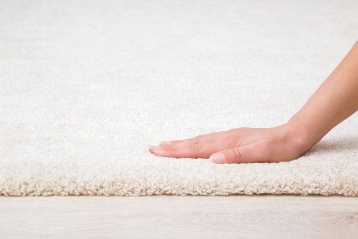 Close up of carpet and hand